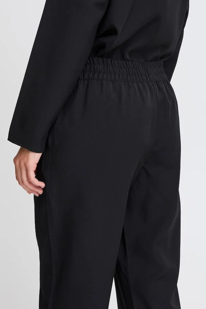 BYMMIDDE TROUSERS BLACK